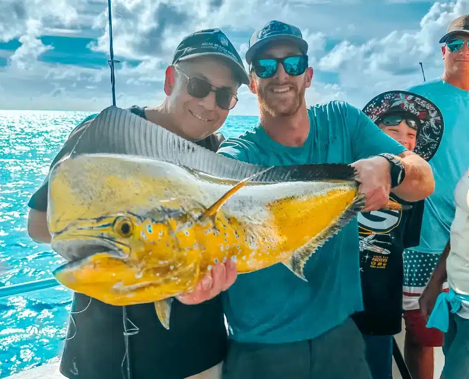 Two men catch a fish in Islamorada